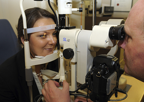 Optometrist With Patient