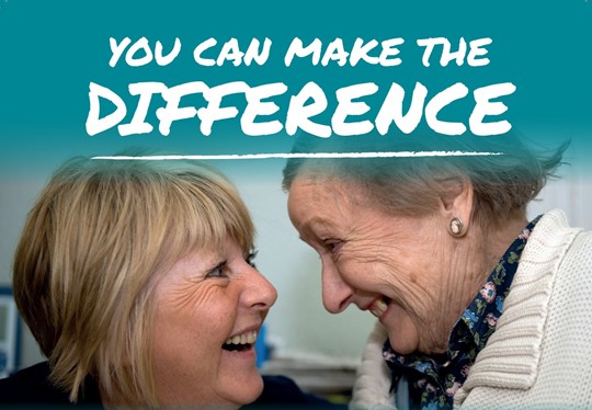 smiling carer and elderly lady - you can make the difference